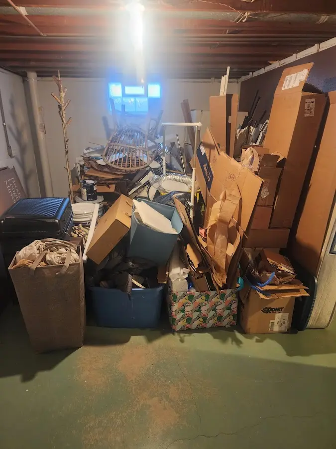 Roll-off dumpster container at job site for 15 Yard Dumpster Rental in Lansing